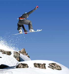 Product development is the key to a dramatic launch toward success for your small company like this snow boarder launching off the mountain into the clear blue sky.